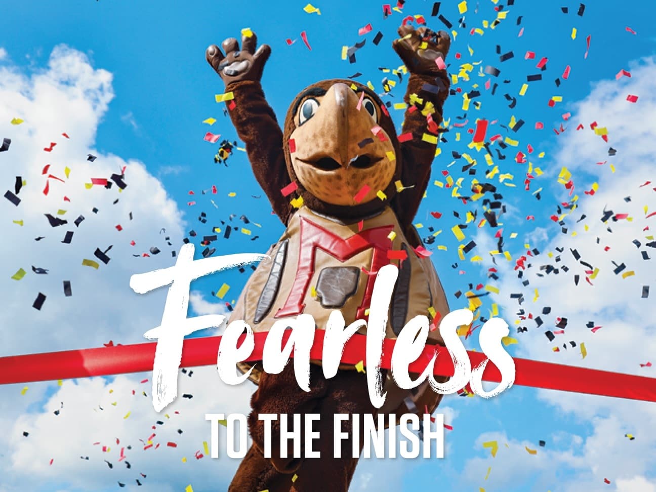 Cover of the Giving Newsletter November 2021 edition with the headline 'Fearless to the Finish' and a Testudo mascot jumping through a finish line as confetti falls around