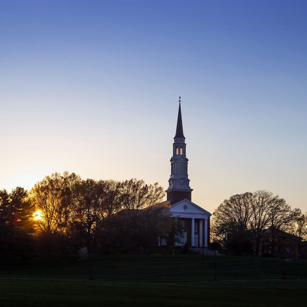 The Memorial Chapel as the sun sets in the background
