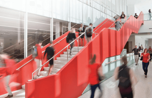 Cover of Giving Newsletters May 2017. Students walking up a red staircase