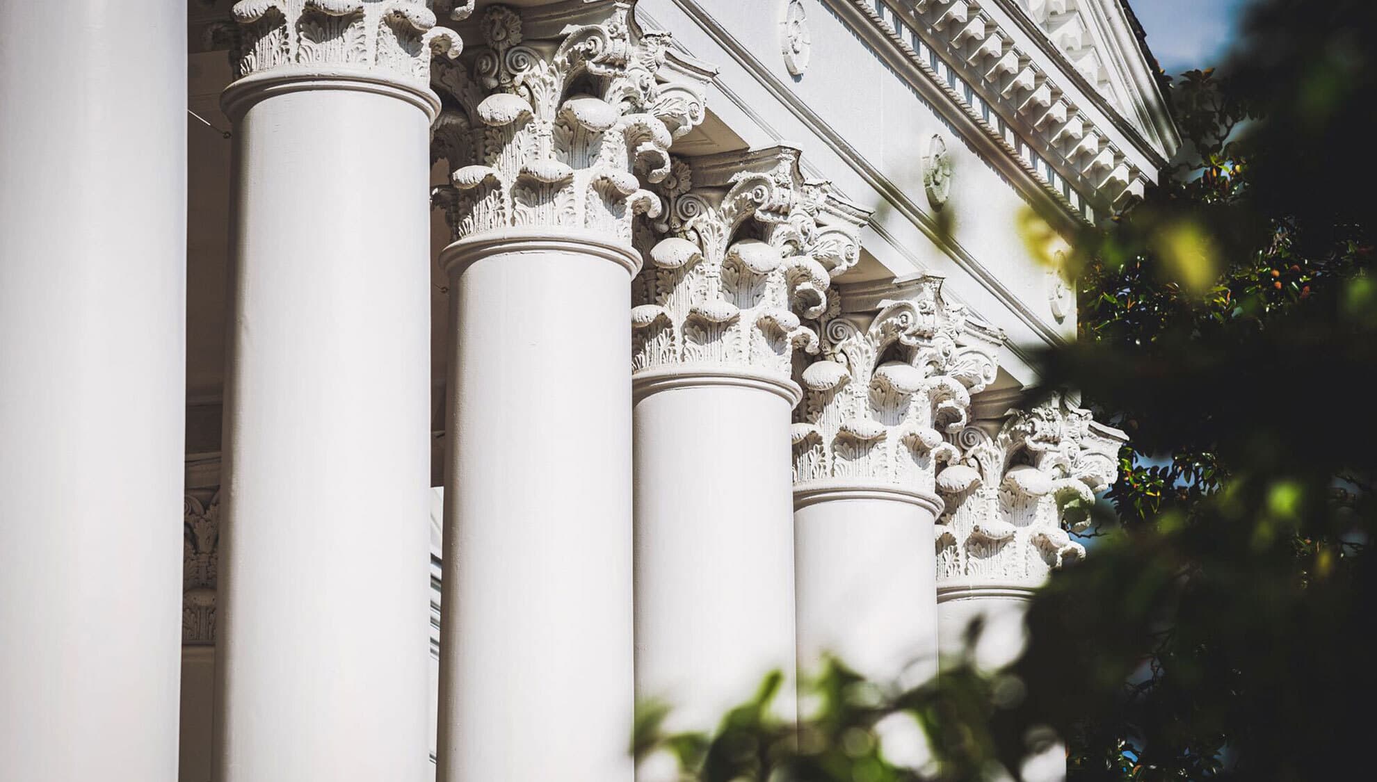 Large white pillars in the front of a building at the University of Maryland